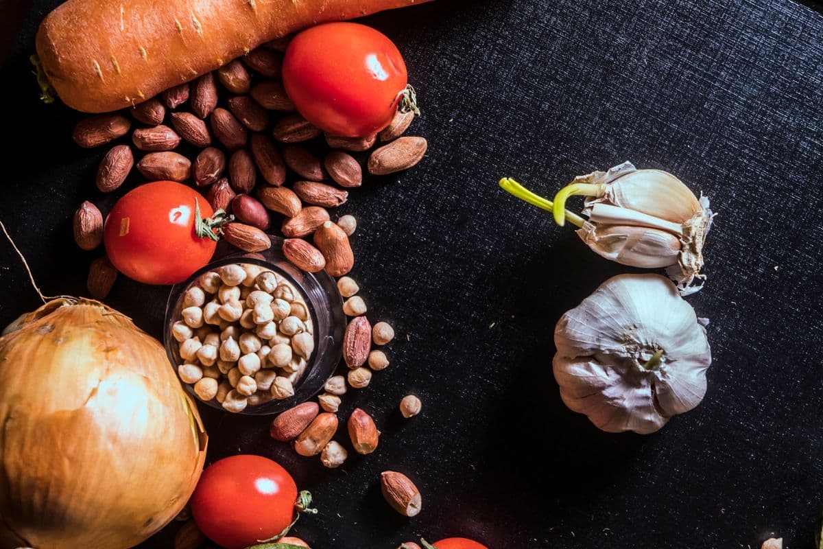Fresh healthy whole foods on a dark surface